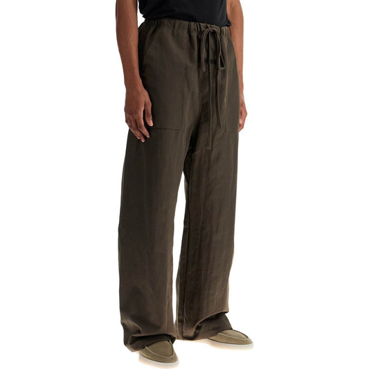 Fear Of God ESSENTIALS textured nylon utility pants for versatile Trousers Fear Of God ESSENTIALS